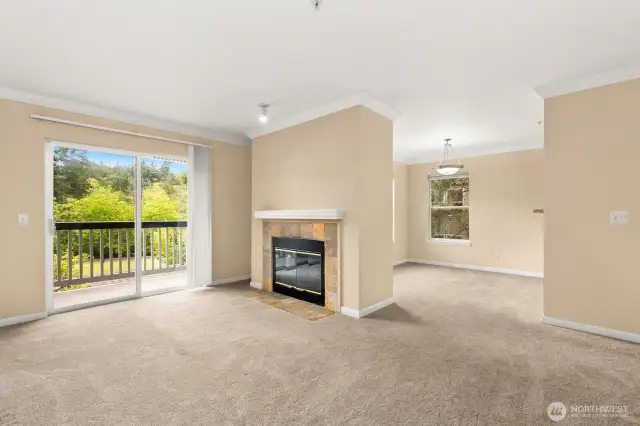 Fresh carpets throughout and cozy gas fireplace create a warm, inviting space.