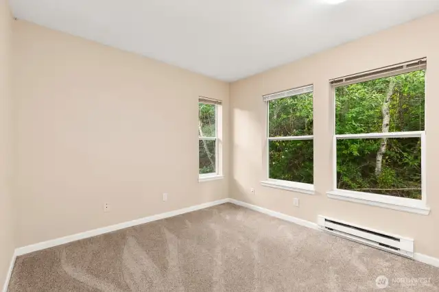 Second bedroom is bright & airy. Also, sits at back of condo with tranquil views.