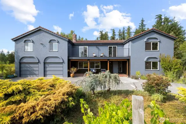 Tucked off the road and surrounded by evergreens, this enchanting 6+ bedroom, 4-bath estate blends Tuscan charm with Pacific Northwest tranquility.