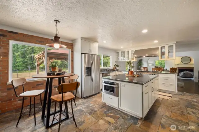 The breakfast area is just off the oversized walk-in pantry and provides access to the back stairway.