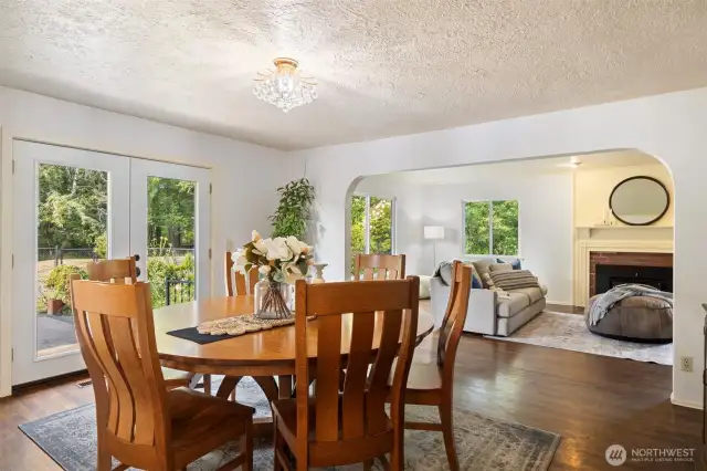 French doors from the dining area open to an expansive back patio, creating seamless indoor-outdoor flow.