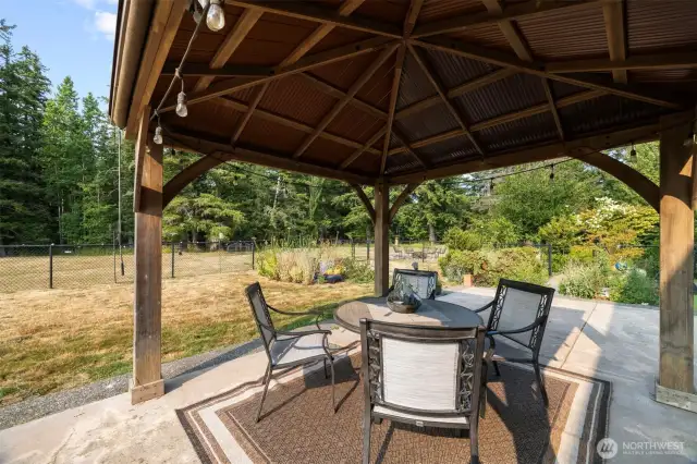 Whether you're sipping coffee under the covered front porch, strolling the woodland trails, or expanding your garden oasis, this is true serenity—complete with wildlife, clean air, and a backdrop of Cascade foothills. Just minutes from Bellingham, yet a world away.
