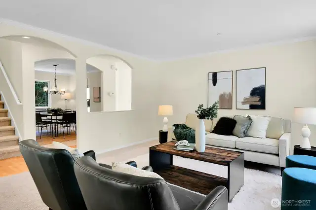 Arches and crown moulding add elegance and connect the roomy living spaces.