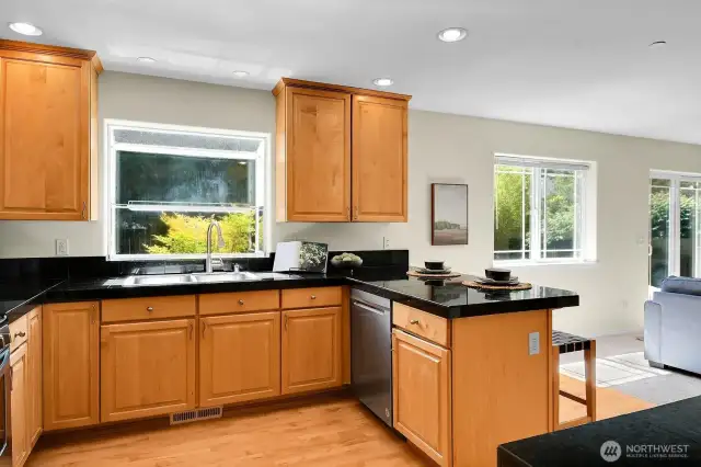This home offers open-concept living AND formal spaces. The kitchen opens to the den and patio for casual gatherings.