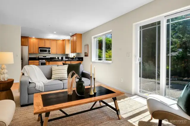 These sliding doors bring in more light and flow right out to the back yard patio, which is plumbed for your gas grill!