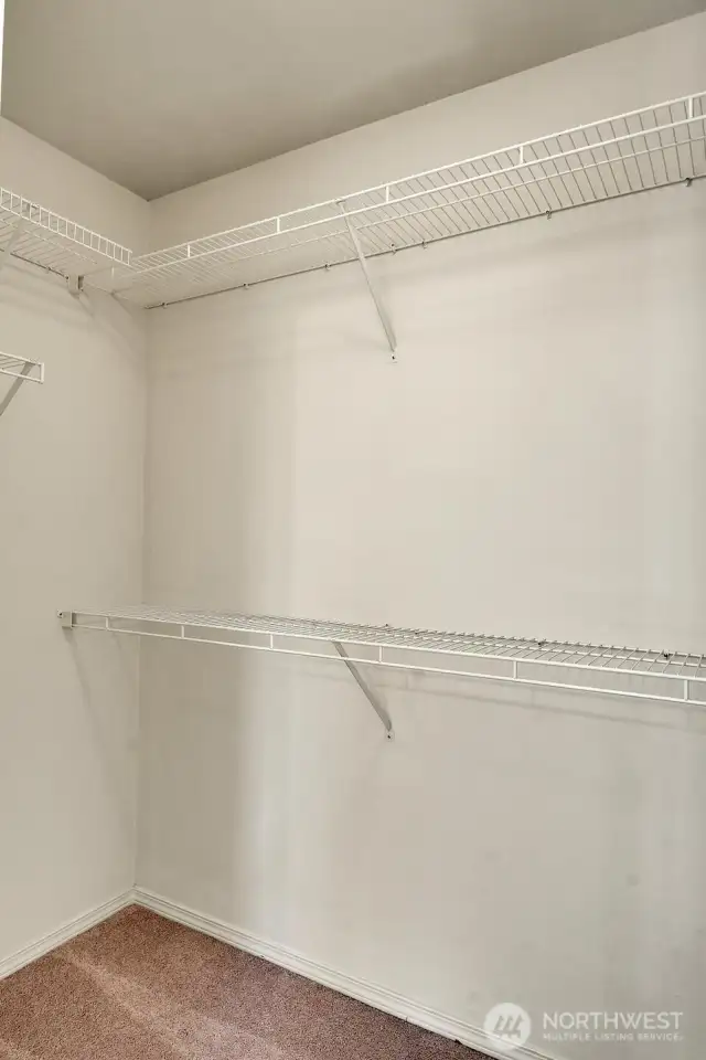 ...and plenty of room for clothes in this large, primary walk-in closet.