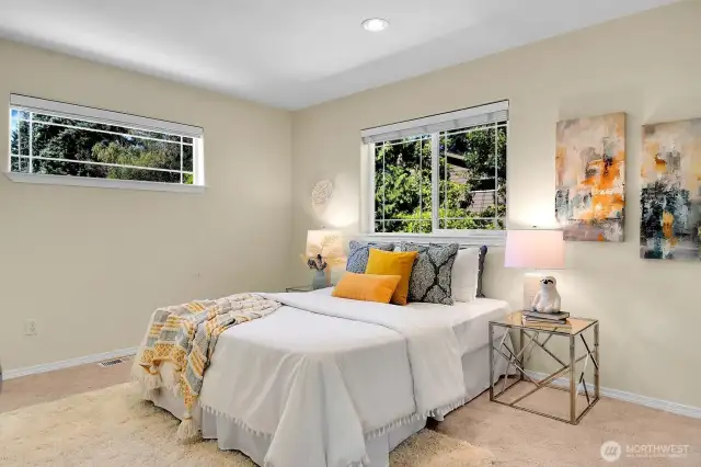 Bedroom #4. All of these rooms feature elegant wood blinds.