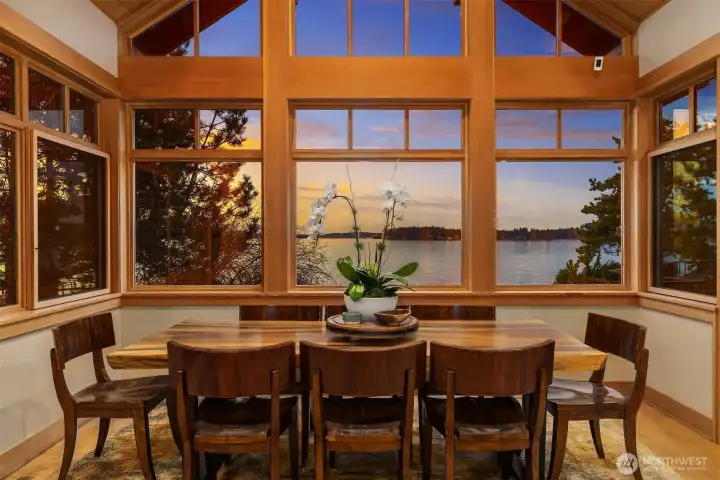 Soaring breakfast nook with wall of windows brining the lake views in!