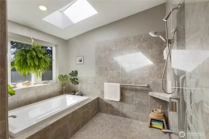 The Primary spa-like bathroom includes large jetted tub and generous shower area.