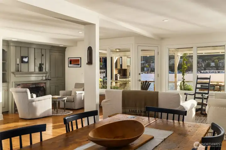 View from the dining room into living room with the water and views just beyond