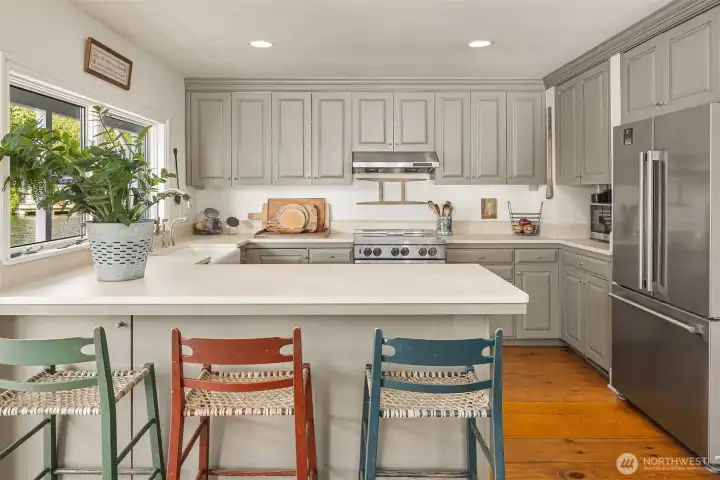 Kitchen with custom cabinetry, stainless appliances and induction cooking!