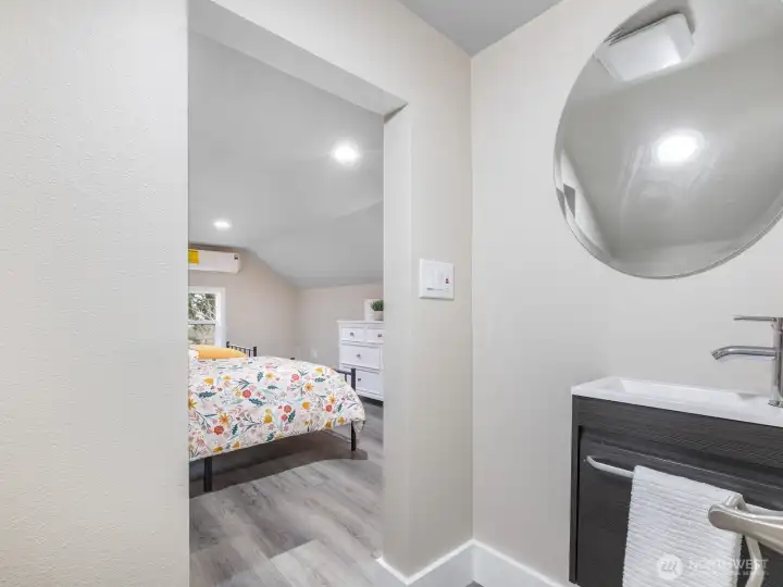 A view from the half bathroom looking into bedroom 3