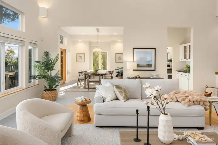 Open-concept living and dining areas with high ceilings and abundant natural light, offering seamless flow for everyday living and entertaining.