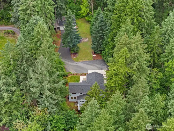 Aerial view here, the 2 acres does extend behind what you can see here