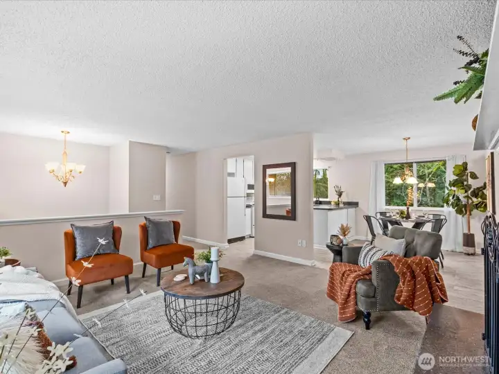 A spacious living room welcomes you with soft natural light and an easy, comfortable layout that invites gathering and relaxation.