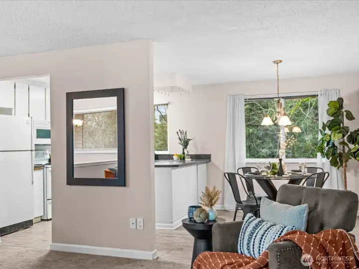 From the living room, the space flows naturally toward the dining area and kitchen, creating an open and connected feel for everyday living.