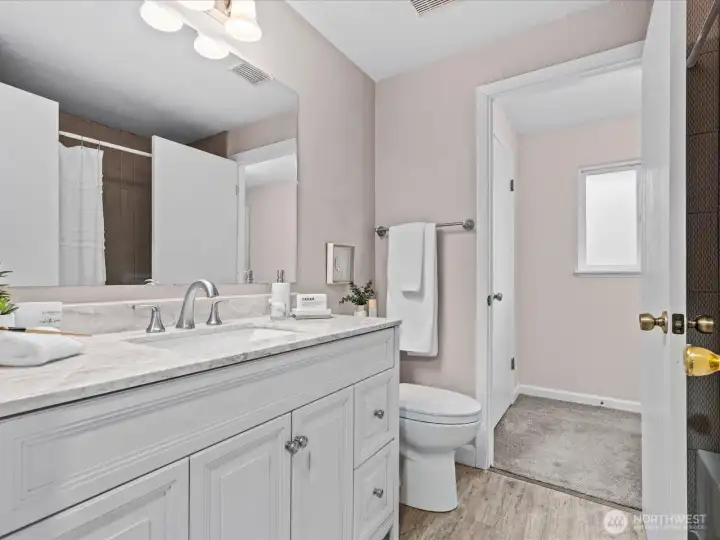 Large vanity in the updated, primary bathroom.