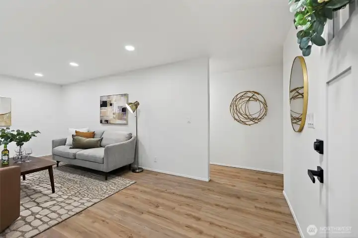 Step inside to warm LVP flooring, recessed lighting, and a clean, open feel with tasteful gold accents that set the tone throughout the home.