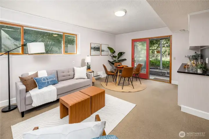 The garden level family room opens through French doors to a lush and welcoming backyard, creating a relaxed gathering space that extends naturally into the landscape.