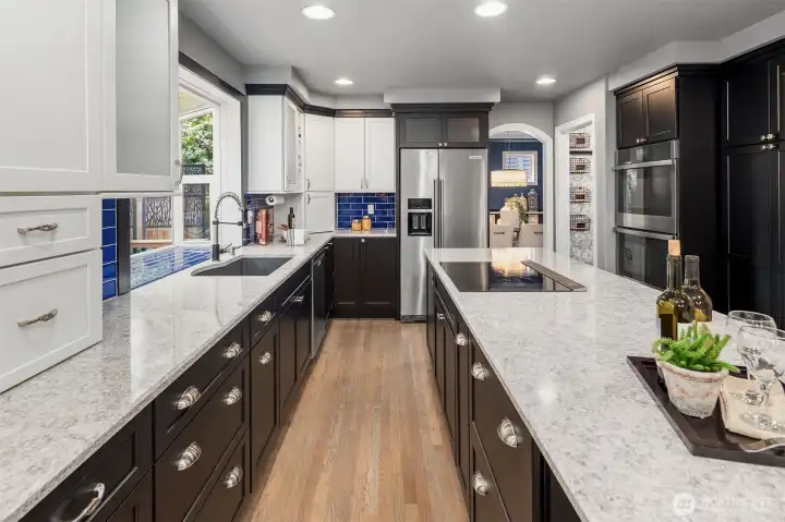 New quartz counters, induction cooktop (plumbed for gas), custom cabinets, and more!