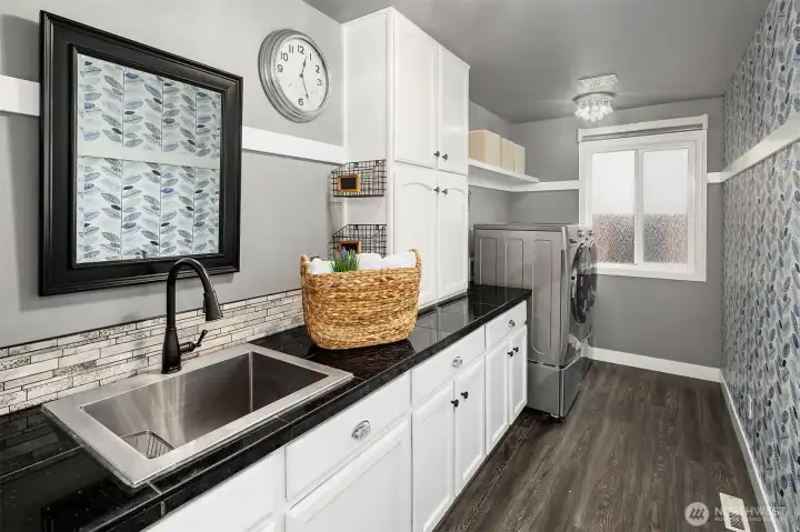 Laundry room on main with built-ins.
