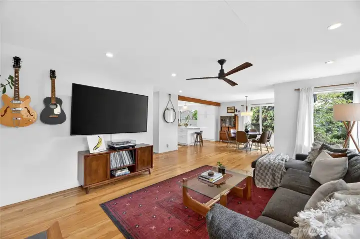 The living room is conveniently located near the dining room and kitchen