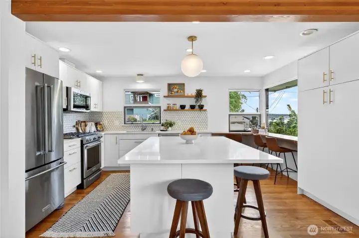 The beautiful kitchen is light and bright with plenty of cabinets and counter space