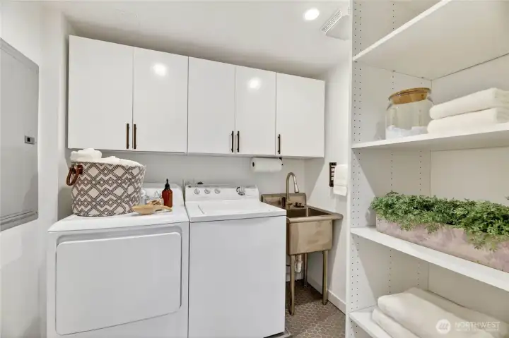 The lower level laundry room with plenty of storage space