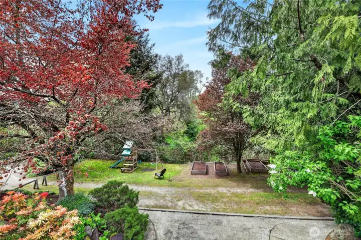 The house backs to a City of Seattle green space.  The owners have used this area for gardening and the play structure