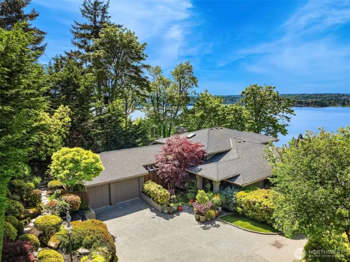 Lush, manicured approach with a private, welcoming presence