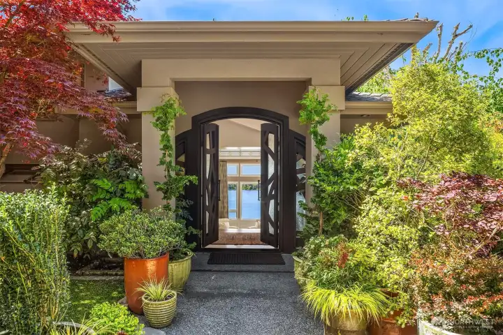 Striking double-door entry opening to glimpses of Lake Washington beyond