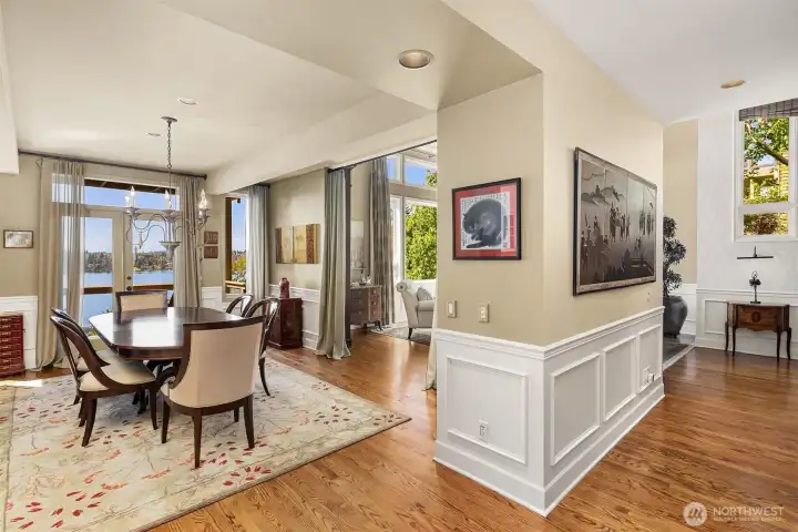 Seamless connection of dining and living spaces creates an effortless flow, all oriented to Lake Washington views.