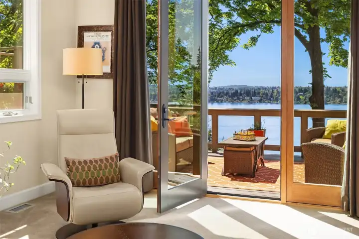 Private deck retreat just beyond the living space—an intimate setting to unwind and take in serene lake and mountain vistas.