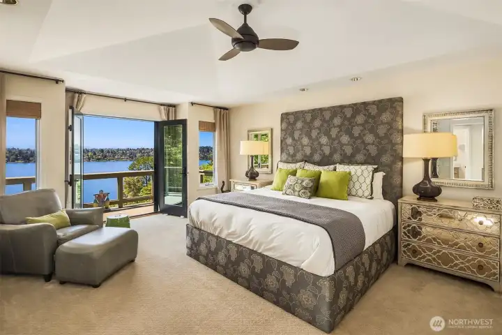 pacious primary suite with private deck access and serene lake and mountain views—an elevated retreat for rest and relaxation.