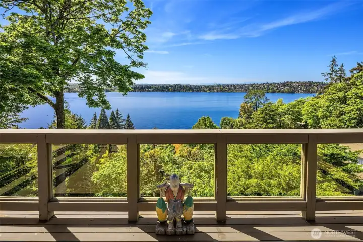 Private primary suite balcony capturing sweeping lake and mountain views—your own serene outdoor escape.
