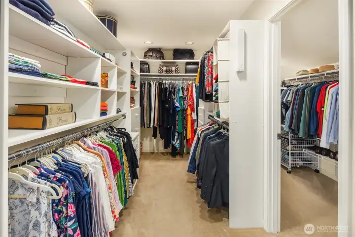 Expansive, boutique-style walk-in closet—paris apartment–sized and thoughtfully designed with abundant custom storage.