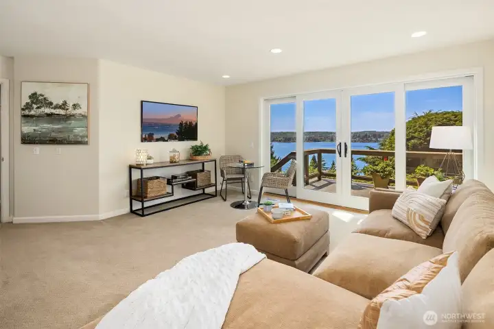 Lower level designed for how you actually live—movie nights, game tables, and easy gathering, all opening to a view deck and Lake Washington beyond. Comfortable, spacious, and effortlessly connected for everyday living and hosting alike.