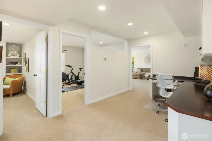 Lower level layout designed for flexibility—dedicated office, fitness, and living spaces all connected for effortless day-to-day flow. Ideal for working from home, staying active, and keeping life seamlessly organized.