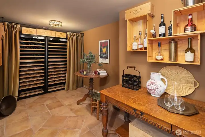 Dedicated wine cellar with custom storage and a warm, intimate atmosphere—designed for collecting, tasting, and lingering. A distinctive lower-level space that invites slow evenings and conversation.