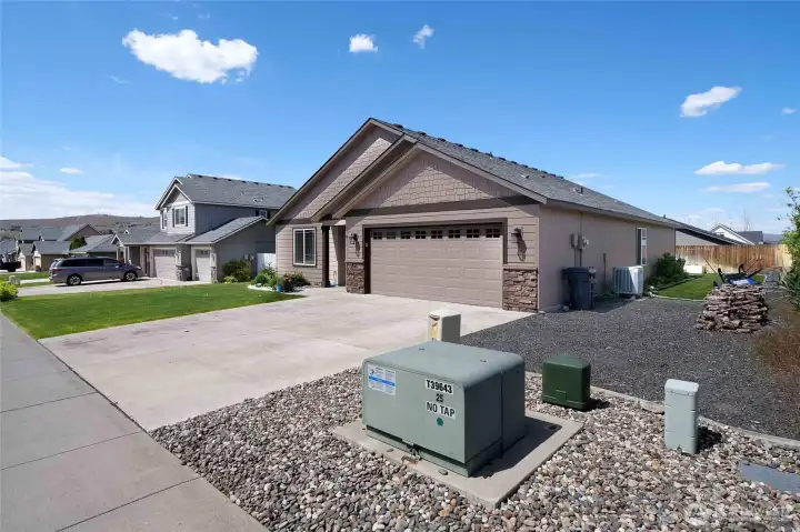 Plenty of room for parking your RV on the side, and check out the beautiful stone accents on the garage, plus the updated garage door windows for natural light.