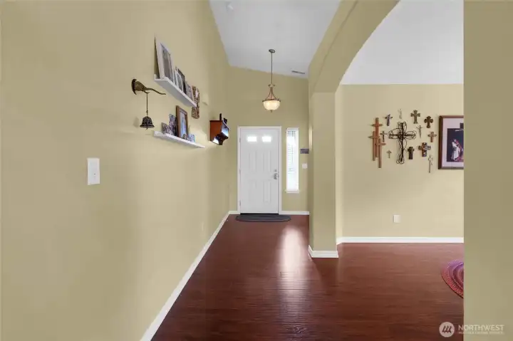 Looking back at the front door, we have the formal dining room to the right, with it's arched entryway and beautiful flooring.
