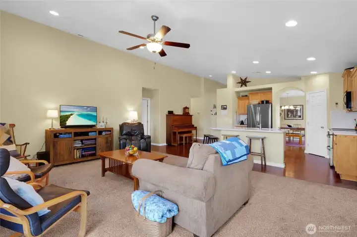 Having wall-to-wall carpeting in a living room just makes it feel that much cozier!  The door in the center leads to the primary bedroom.