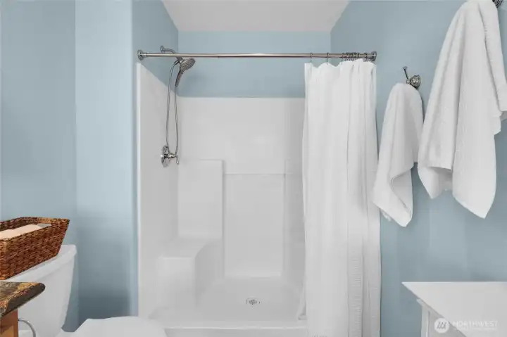 The spacious shower enclosure in the primary bathroom.