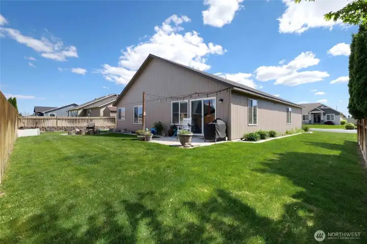 The lawn is well-manicured in this corner of the yard, and quite large for you to enjoy this lot in Prairie Bluff.