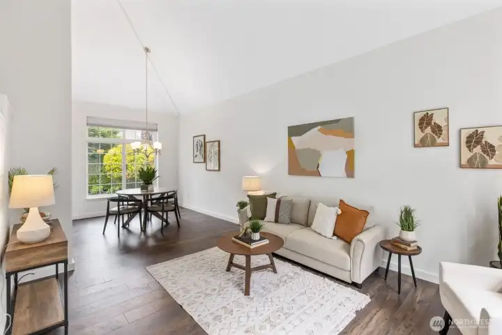 Northwest living with timeless comfort and style. Soaring vaulted ceilings and expansive windows fill the home with natural light