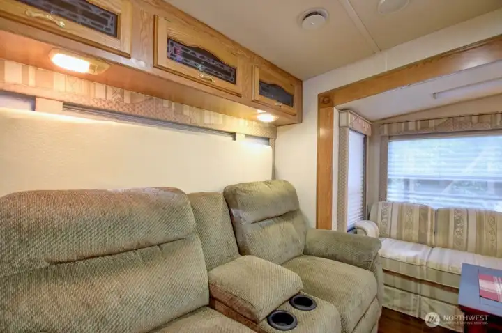 Living room area with additional storage options above