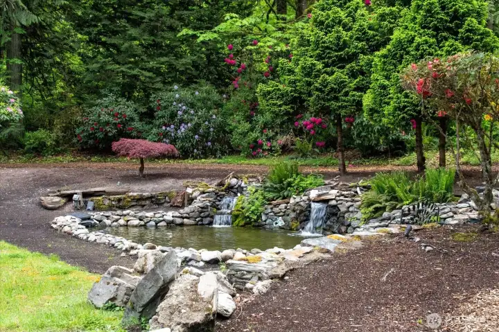 This serene and tranquil 5 pool waterfall system is a unique one-of-a-kind feature. This serene and tranquil 5 pool waterfall system is a unique one-of-a-kind feature.