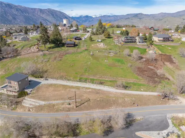 Aerial view 3 of homesite and surrounding mountains and views of Lake Chelan.