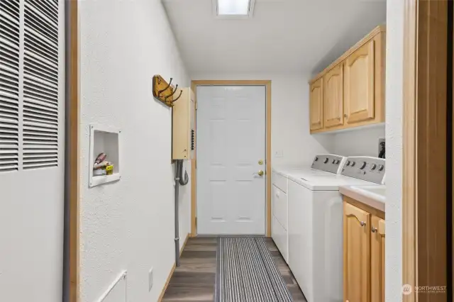 Laundry room with washer/dryer and door to the 2 car garage