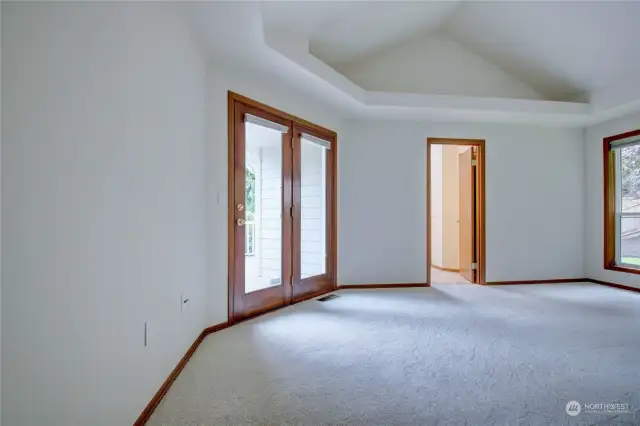 Primary Bedroom with doors to decj